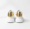 Alexander McQueen Oversized Sneaker – White/gold Luxury Craftsmanship & Urban Style