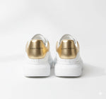 Alexander McQueen Oversized Sneaker – White/gold Luxury Craftsmanship & Urban Style