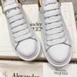 Alexander McQueen Oversized Sneaker – White/gold Luxury Craftsmanship & Urban Style
