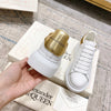 Alexander McQueen Oversized Sneaker – White/gold Luxury Craftsmanship & Urban Style