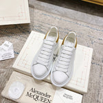 Alexander McQueen Oversized Sneaker – White/gold Luxury Craftsmanship & Urban Style