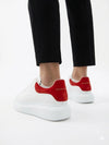 Alexander McQueen Oversized Leather Sneakers – White with Red Heel